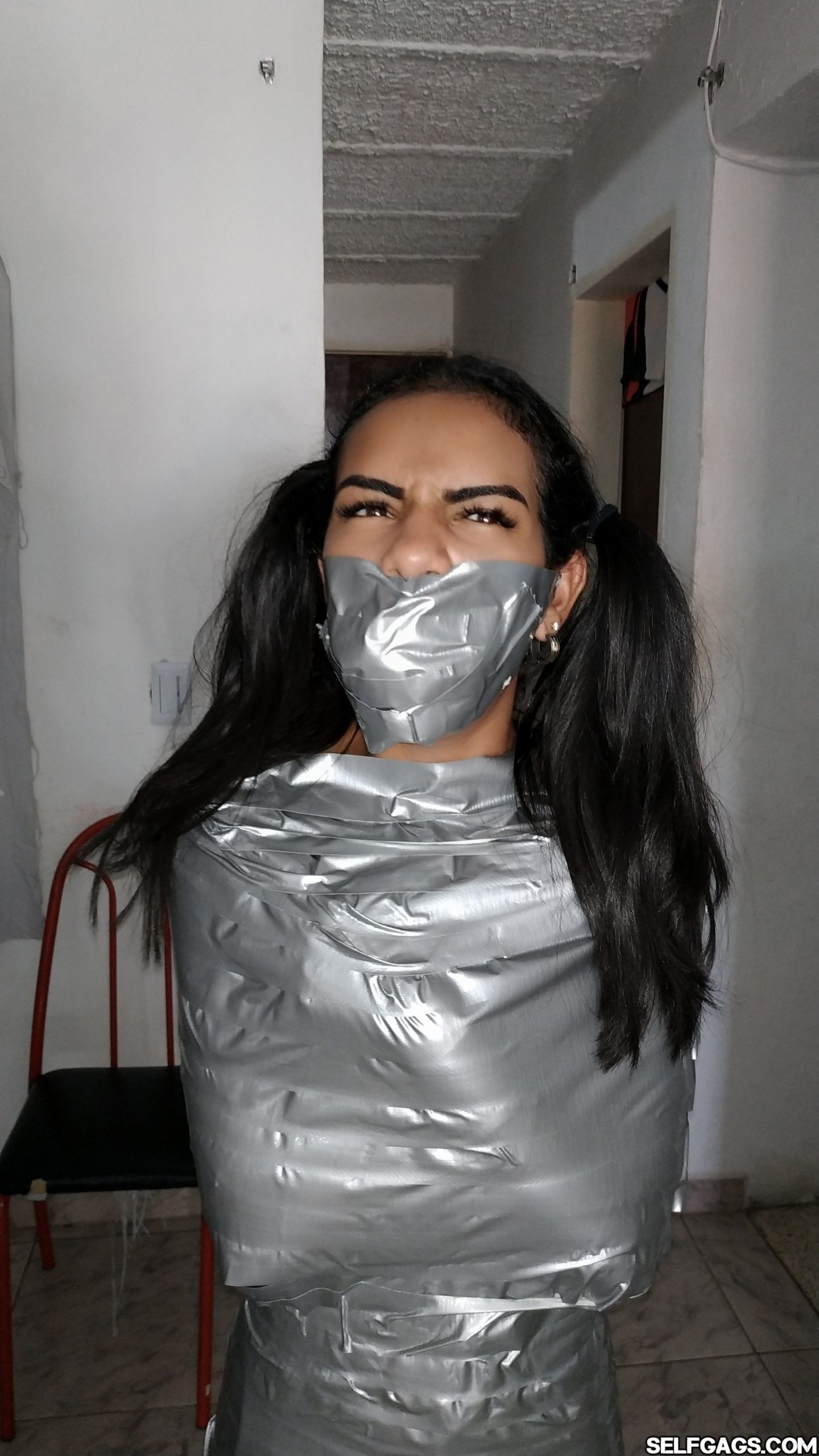 Tape Gagged Girl In Mummification Bondage