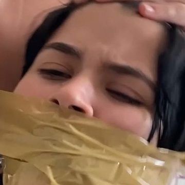 Tape wrap gagging her sister