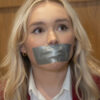 Blonde woman with wavy hair and gold hoop earrings gagged with silver duct tape across her mouth, eyes looking upward